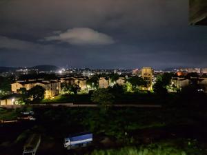 a view of a city at night at Uttam Hotel & Restaurant in Guwahati