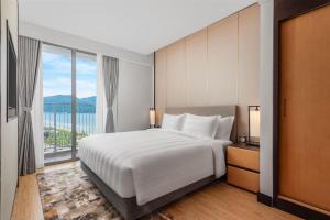 Postel nebo postele na pokoji v ubytování Wyndham Soleil Danang
