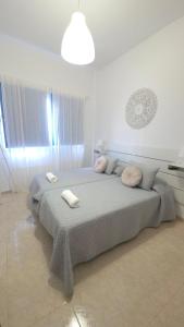 a bedroom with two beds with towels on them at La Abundancia in La Restinga