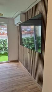 a room with a large window in the wall at Apartamentos Pino in Benidorm +99 photos