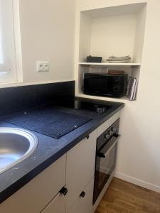 Køkken eller tekøkken på Petit nid douillet centre-ville + 2 billeder