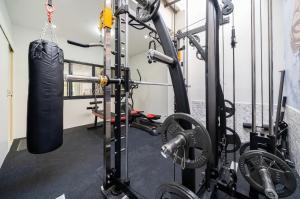 a gym with a punching bag and a fight belt at Laguna Townhouse with private pool and your own gym near Bangtao Beach in Laguna Phuket
