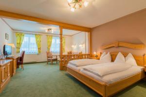 Postel nebo postele na pokoji v ubytování Posthotel Radstadt