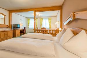 Postel nebo postele na pokoji v ubytování Posthotel Radstadt