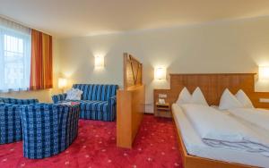 Postel nebo postele na pokoji v ubytování Posthotel Radstadt