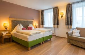 Postel nebo postele na pokoji v ubytování Posthotel Radstadt