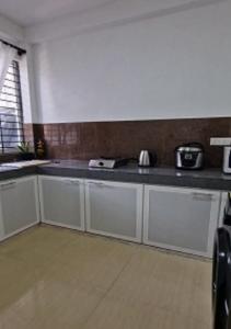 Kuchyň nebo kuchyňský kout v ubytování Rajinis-Place + 19 fotografií