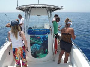 a group of people on a boat in the ocean at Esperando in Maroni