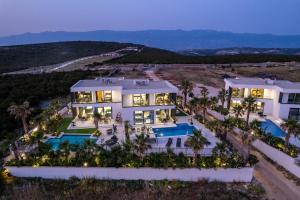 an aerial view of a house with a swimming pool at Villa Dubai in Novalja