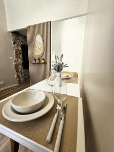 a table with plates and wine glasses on it at Azura in Antibes +16 photos