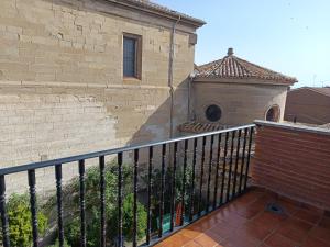 a balcony with a black fence and a building at B&B Santiago de Redecilla del camino in Redecilla del Camino