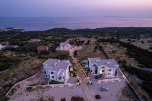 an aerial view of a large white house at Villa London in Novalja