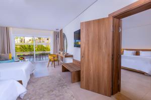Postel nebo postele na pokoji v ubytování Amwaj Oyoun Resort & Casino + 37 fotografií
