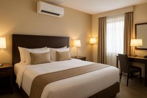 a hotel room with a large bed and a desk at Beach Resort Paradise Bungalows in Trincomalee +2 photos