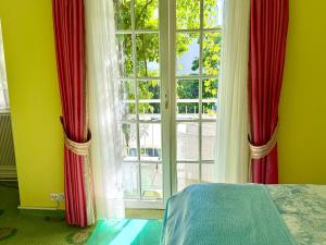 Postel nebo postele na pokoji v ubytování Boutique Hotel Villa am See + 37 fotografií