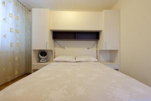 Postel nebo postele na pokoji v ubytování Apartments Avdić