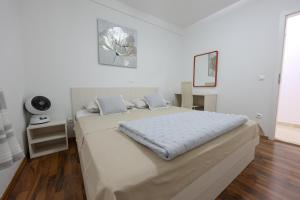 Postel nebo postele na pokoji v ubytování Apartments Avdić