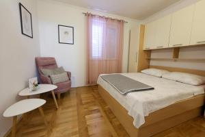 Postel nebo postele na pokoji v ubytování Apartments Avdić