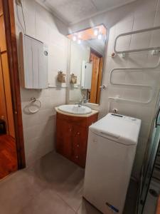 a small bathroom with a sink and a mirror at Tu refugio cómodo y con piscina - Herbasabina 2 in Pla de l'Ermita