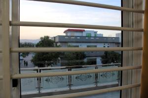 a view of a building from a window at Capital Pearl Guest House in Islamabad