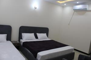 Ένα ή περισσότερα κρεβάτια σε δωμάτιο στο Capital Pearl Guest House