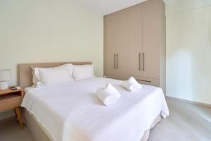 Кровать или кровати в номере Zoe's Luxury Apartment