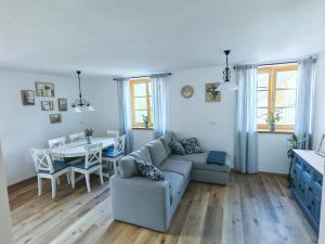 a living room with a couch and a table at Hiša Šturm in Tolmin