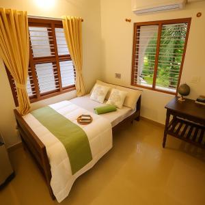 Postel nebo postele na pokoji v ubytování MyYearlyStay in Udupi