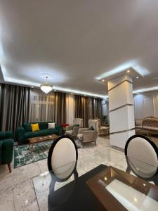 a living room with a couch and a table at Villa waterway 2 in Cairo