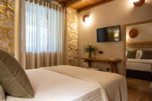 Ένα ή περισσότερα κρεβάτια σε δωμάτιο στο Plasis Country Suites +36 φωτογραφίες