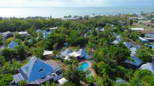 an aerial view of a resort with blue roofs at Kellys Beach Resort in Bargara