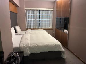 新麗旅店 Newful Hotel 객실 침대
