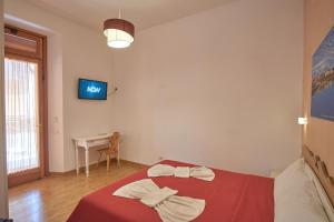 Postel nebo postele na pokoji v ubytování Bel Sole Guest House