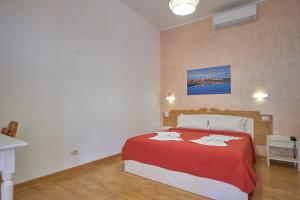 Postel nebo postele na pokoji v ubytování Bel Sole Guest House
