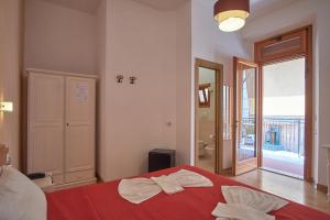 Postel nebo postele na pokoji v ubytování Bel Sole Guest House