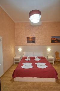 Postel nebo postele na pokoji v ubytování Bel Sole Guest House