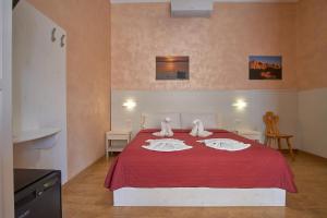 Postel nebo postele na pokoji v ubytování Bel Sole Guest House