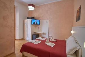 Postel nebo postele na pokoji v ubytování Bel Sole Guest House