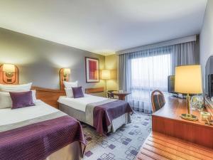 Posteľ alebo postele v izbe v ubytovaní Mercure Cieszyn