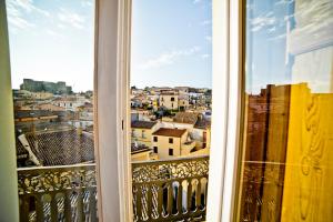 a view of a city from a balcony at La Casa nel Borgo Antico in Melfi