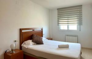 Postel nebo postele na pokoji v ubytování Home Vila-seca Town