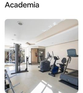 a gym with treadmills and elliptical machines at Lê premier in São Paulo
