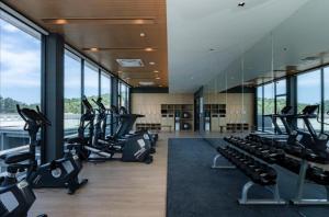 a gym with treadmills and ellipticals in a building at Pool View Wyndham Condo 1310 in Nai Thon Beach