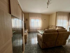 a living room with a couch and a table at Molise Rigenera in Isernia