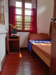 Postel nebo postele na pokoji v ubytování A-Seven House Sagada + 13 fotografií