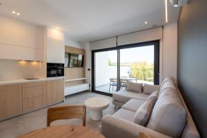 a living room with a couch and a table at As Casas do Castro "Curota" in A Pobra do Caramiñal