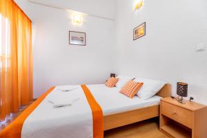 Postel nebo postele na pokoji v ubytování Apartments Mikulina