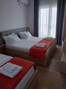 Postel nebo postele na pokoji v ubytování Hotel Ionian