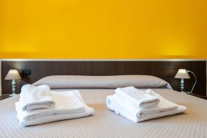 Postel nebo postele na pokoji v ubytování Hotel Marina