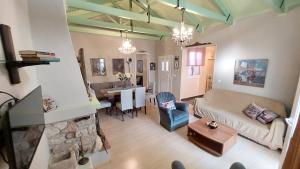 a living room with a couch and a table at Niriides Apartments & Studio in Vathi